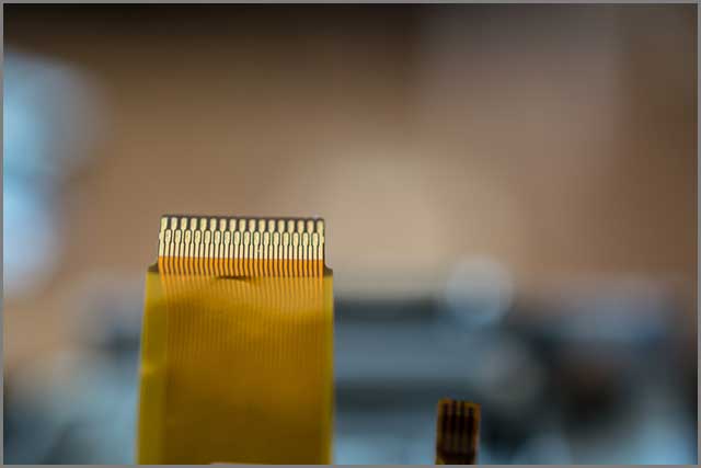 An image of flat and ribbon cable on blurred background