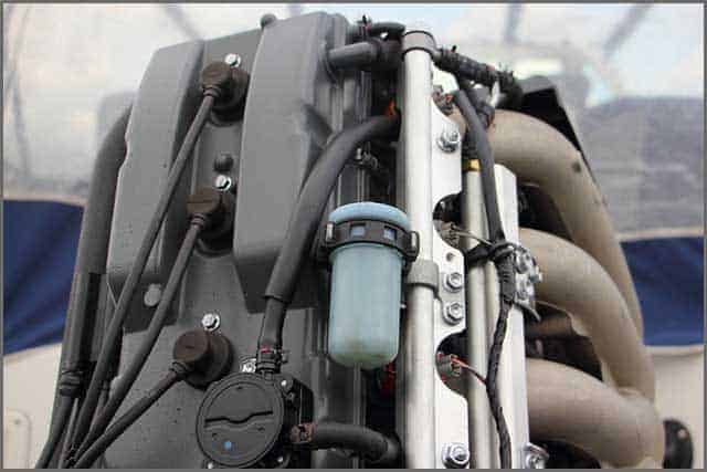 Close up the rear side of boat transom four-stroke outboard motor