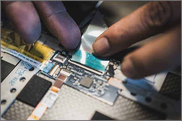 Plugging in a ribbon cable which connect circuit boards and components