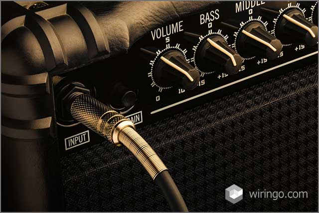 Black Guitar Amplifier with jack plugged in