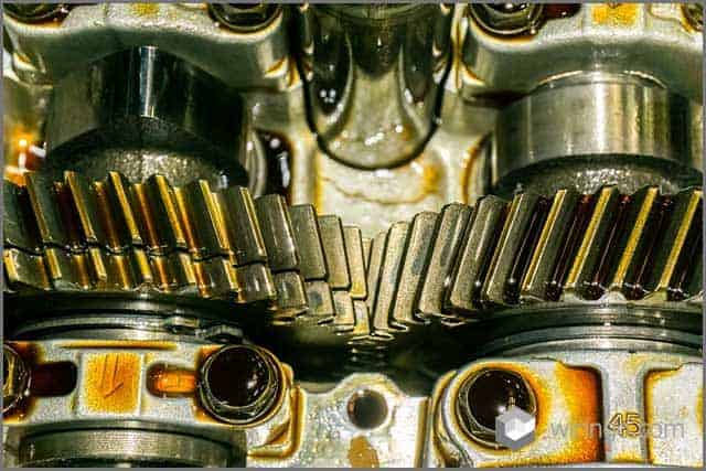 Gears in a car engine with lubricant oil on repairing