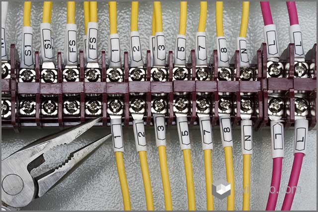 A custom cable assembly labeled precisely with numbers and alphabets