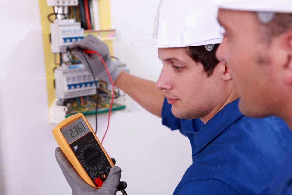 electrical engineers testing electrical equipment