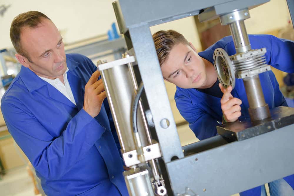 Workers checking the machine