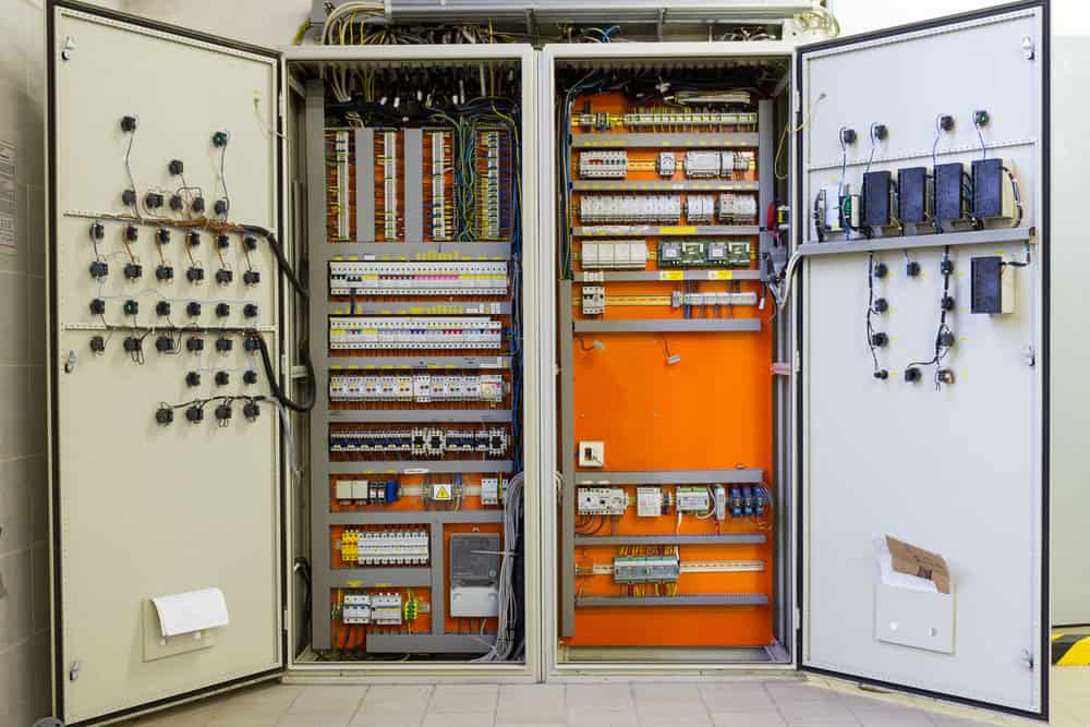 electricity distribution box with circuit breakers and wires