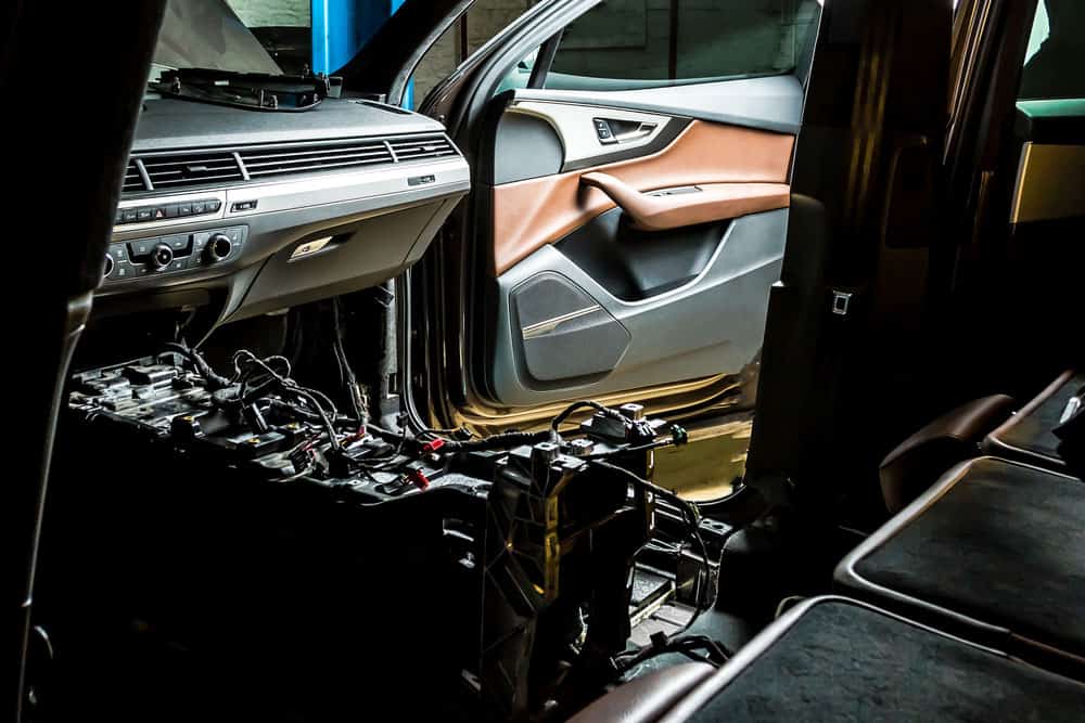 A mechanic checking car wiring