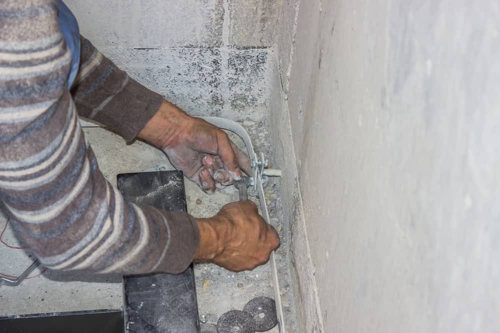 Installing a grounding system in an elevator shaft