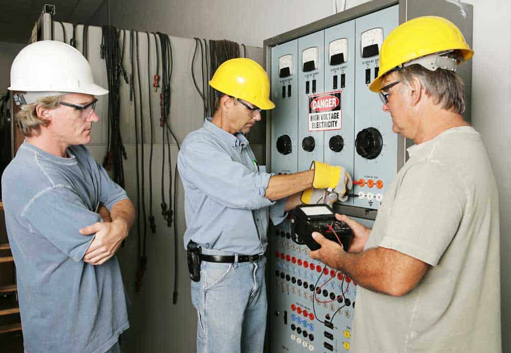 Men working in appropriate safety clothes 