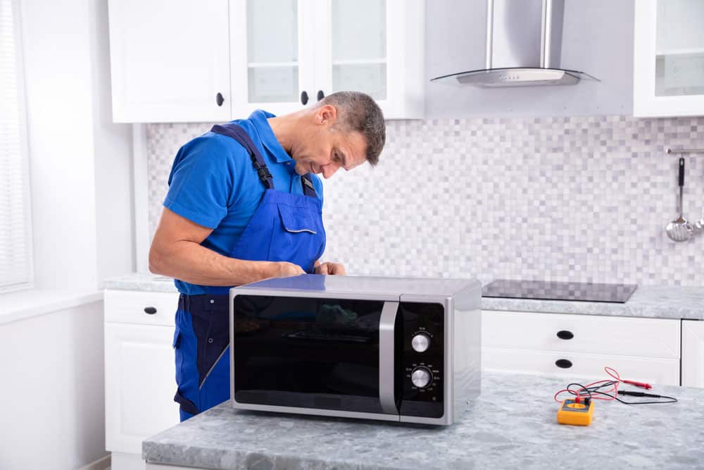 Electrician testing household equipment