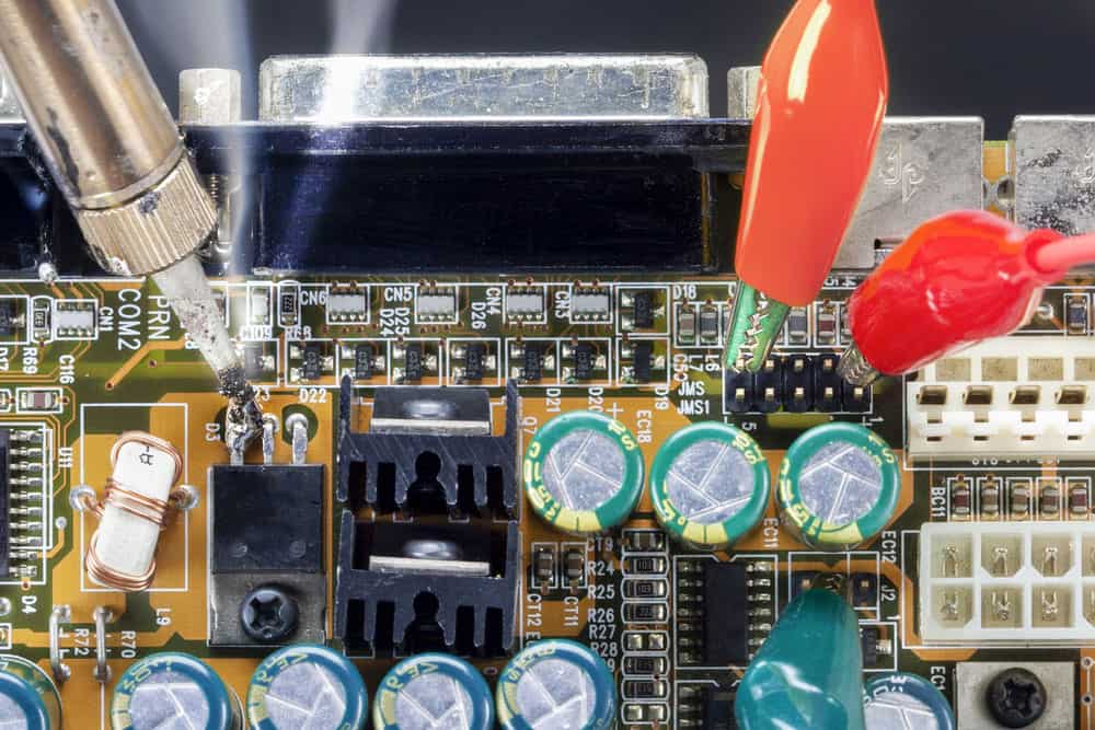 Soldering iron and repairing electronic circuits
