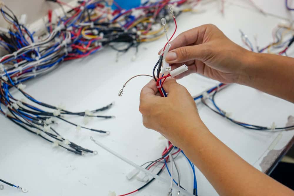 Cable assembly manufacturing process: 
 Assembling a cable harness